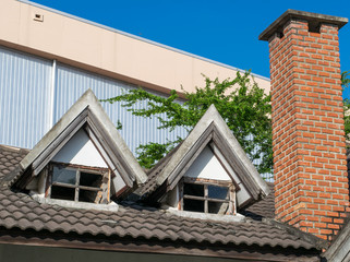 Roof of old house on blue sky