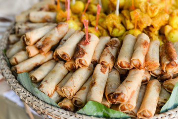 Fresh deep fried spring rolls on wood tray for serve in cocktail party