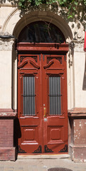 Fototapeta na wymiar Old beautiful door in a stone building