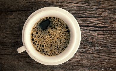 coffee cup on old wood grunge background
