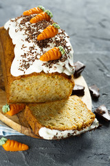 Carrot and orange cake, decorated with carrots