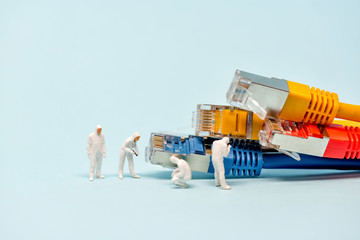 Technicians with multicolored network cables - obrazy, fototapety, plakaty