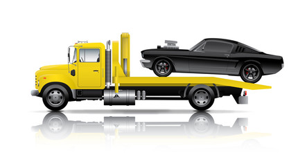 yellow truck towing black muscle car
