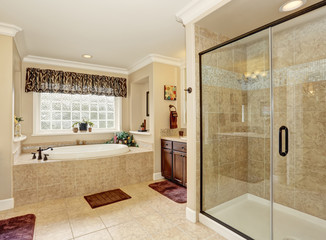 Master bathroom design with beige tile.