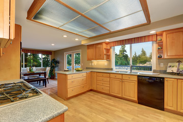 Bright wooden kitchen interior with hardwood floor.