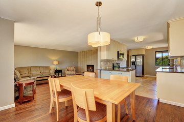 Dining room with maple table and exit to the back deck.