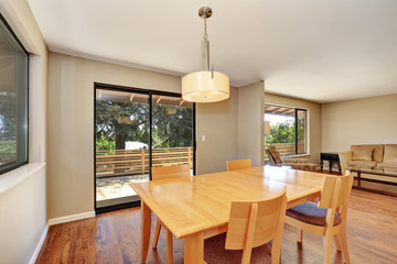 Dining room with maple table and exit to the deck.