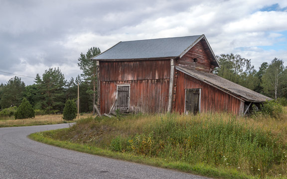 Red barn next to village road