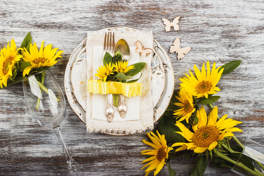 Tableware and silverware with sunflowers