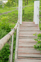 Metal shackle connect the sling and rope tied knot of bridge