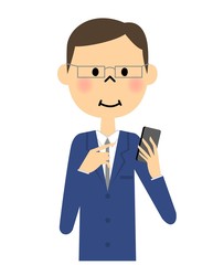 スマートフォンを触るスーツの男性