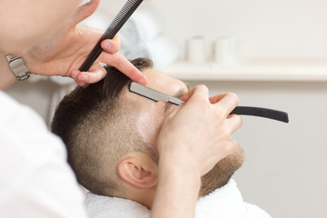 hairdresser to trim the hair straight razor