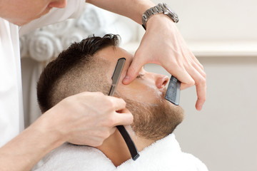 barber to trim the hair straight razor