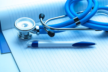 Empty prescription  lying on table with stethoscope