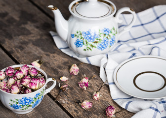 still life with tea cup and tablecloth on wooden table