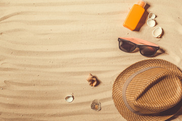 Summer hat put on the tropical sand beach