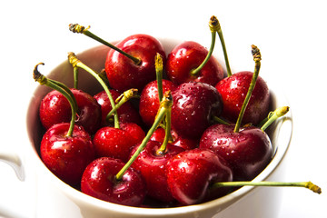 A cup of fresh juicy organic cherries