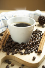 Hot espresso cup on coffee bean