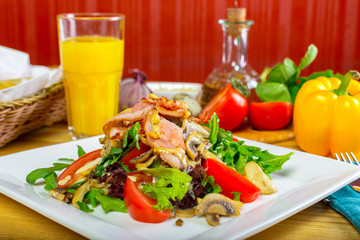 Warm mushroom salad with chilli and tomatoes