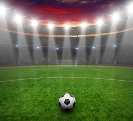 Soccer ball on green stadium