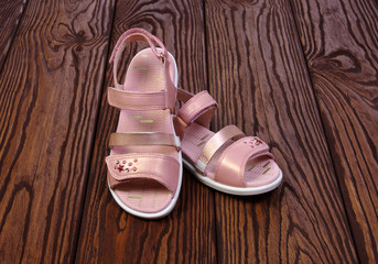 Child's sandals on a wood