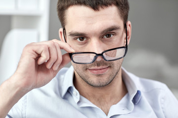 portrait of businessman in eyeglasses at office