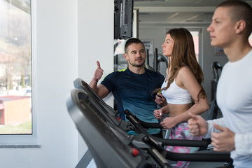Personal Trainer Showing Ok Sign To Client