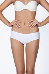 health and beauty - woman in cotton underwear showing slimming c