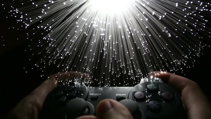 Game controller  with Fiber optics background, shot in HD - Powered by Adobe