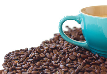 Coffee beans and blue coffee cup isolated on white