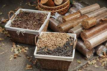 Wicker baskets with different kinds of pelleted compound feed on agricultural exhibition