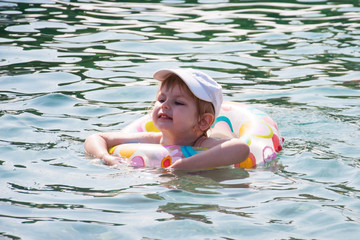 happy child swimming in the sea