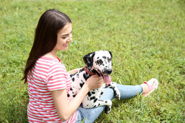 Owner with her dalmatian dog outside