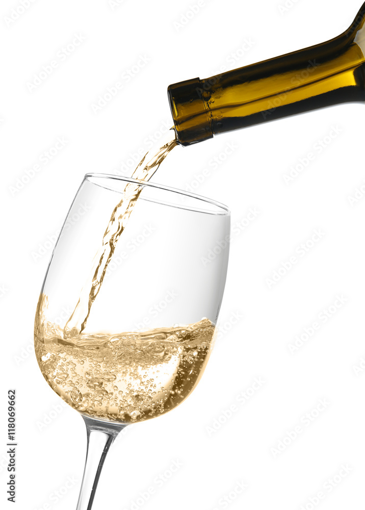 Wall mural White wine pouring into wine glass, isolated on white