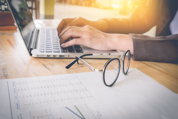 Business woman working at the office. analysis document and usin