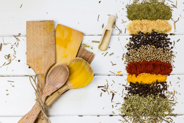 Spices and wooden accessories on white background, soft focus