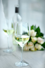 Gentle composition of romantic date with wine and flowers