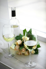 Gentle composition of romantic date with wine and flowers