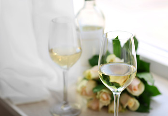Gentle composition of romantic date with wine and flowers
