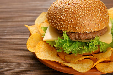 Fresh cheeseburger on wooden background