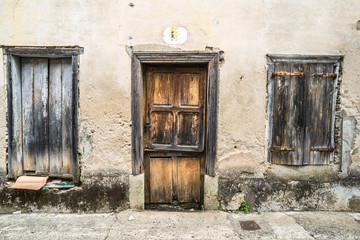 Old abandoned and decaying house facade in a rural  French town