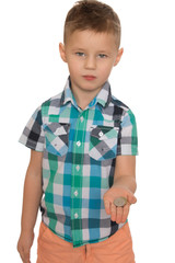 Boy holding a coin