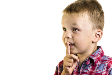 Boy shows a finger near the lips secret