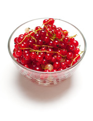 The red currant berries in the glass pot