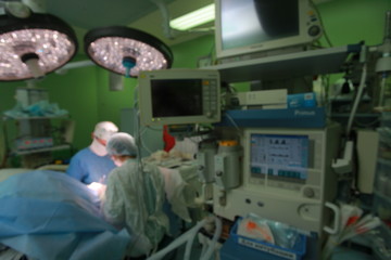 Blur of Doctor Surgeons team working with Monitoring of patient.