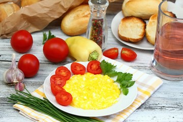 Breakfast of scrambled eggs, baguettes  & vegetable
