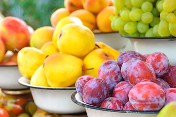 Farm market photo with different vegetables, fruits and homemade preserves - shallow depth of field.