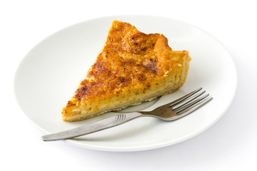 Homemade pumpkin pie on a plate isolated on white background

