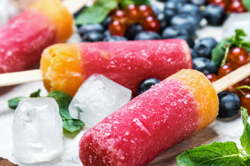 popsicles with red currants and blueberries