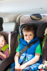 Portrait of boy listening to music in a car trip